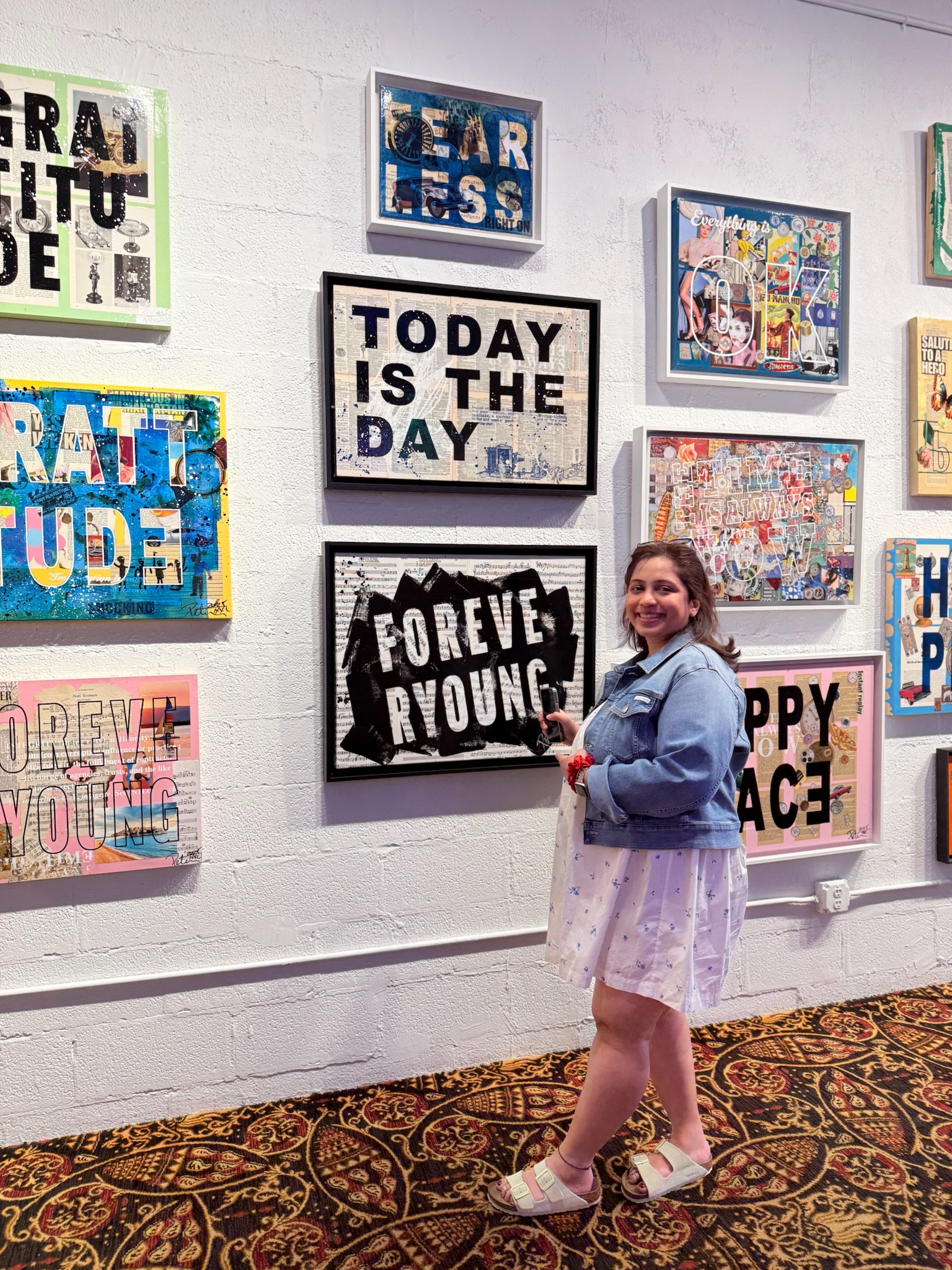 Ankita visiting a wall of colourful art